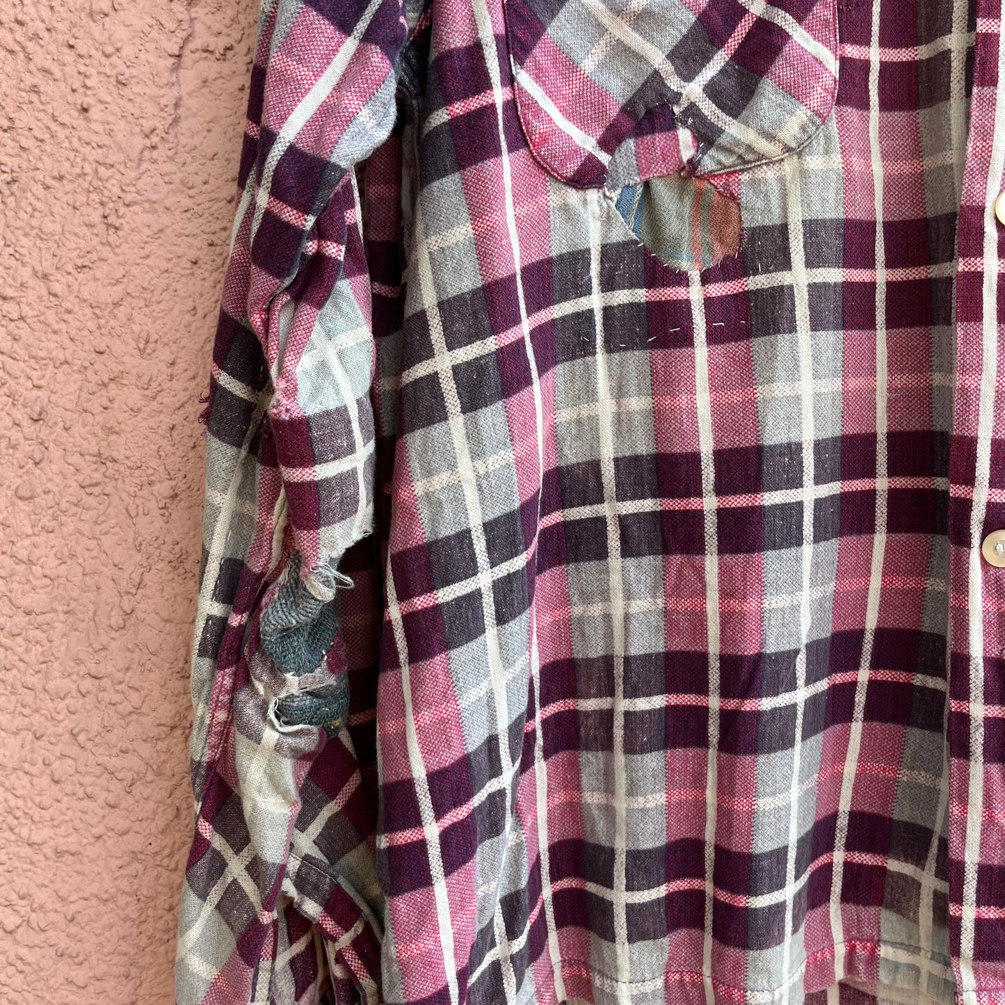 repaired sanforized button up shirt.