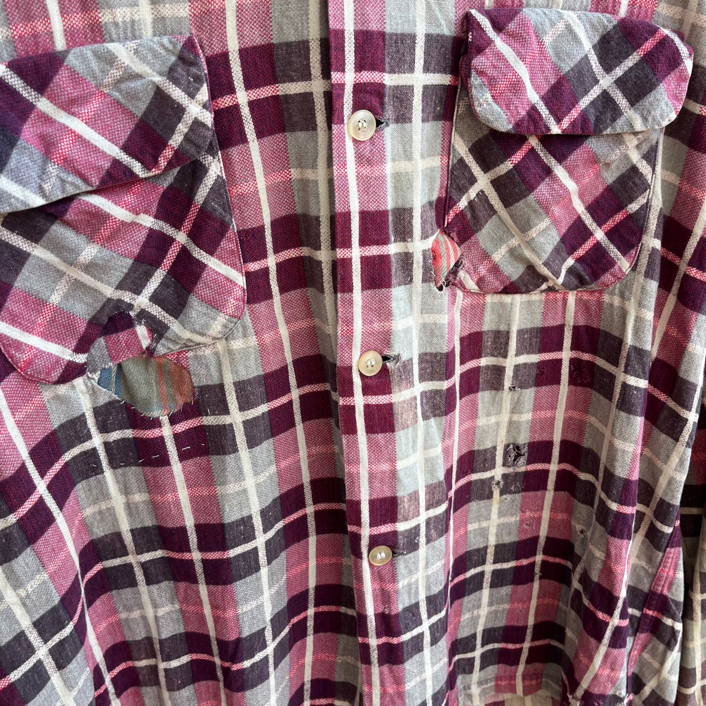 repaired sanforized button up shirt.
