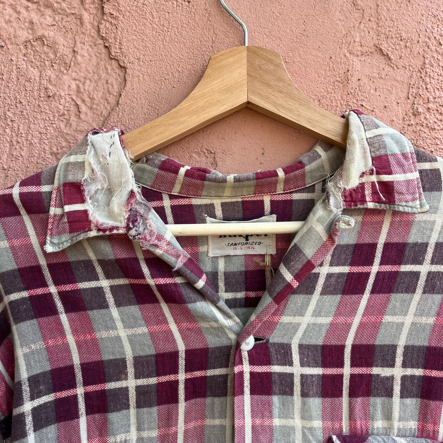 repaired sanforized button up shirt.