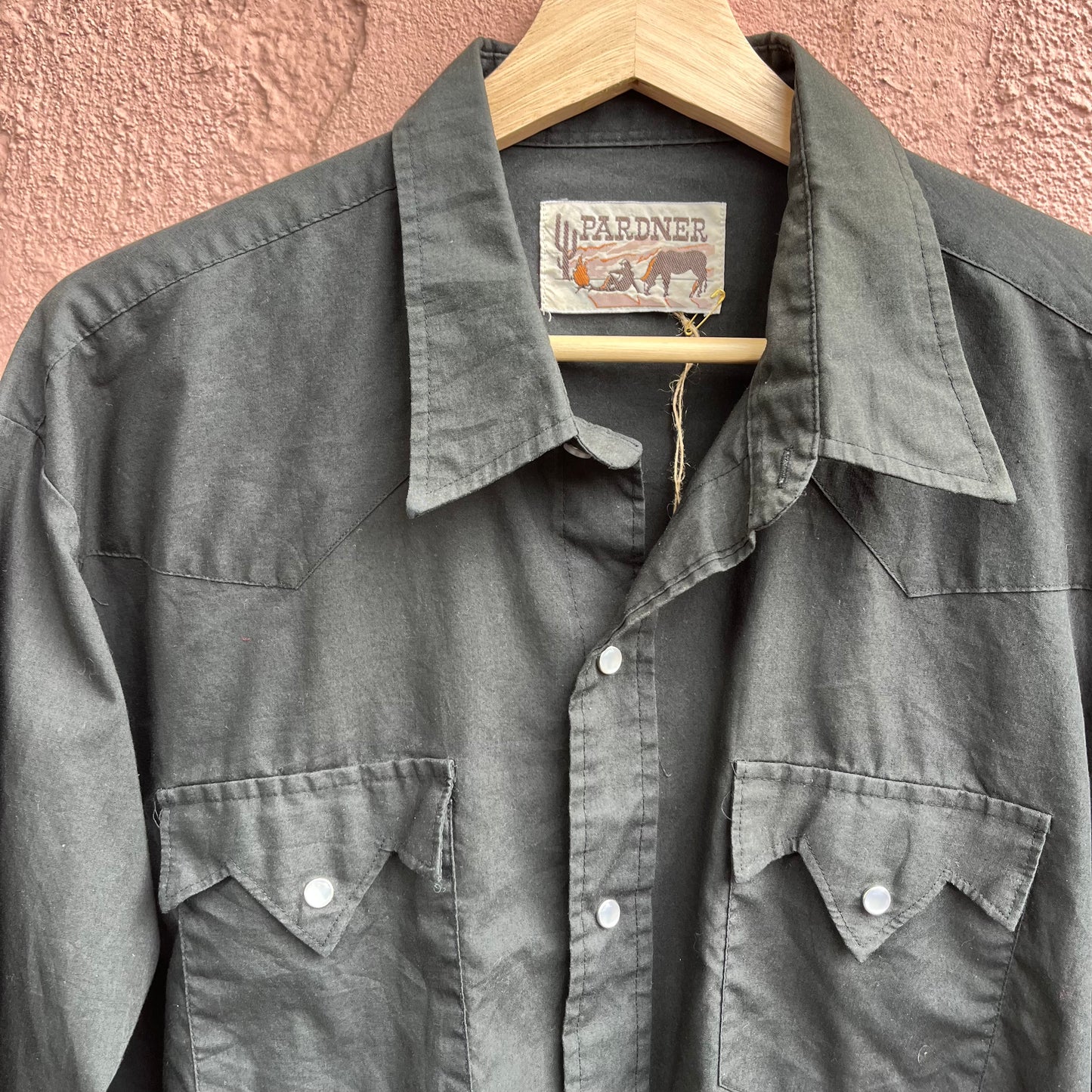 classic pearl snap on black western shirt